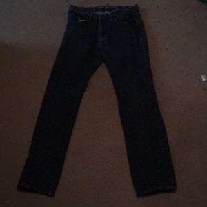 Men’s medium/dark wash jeans.
